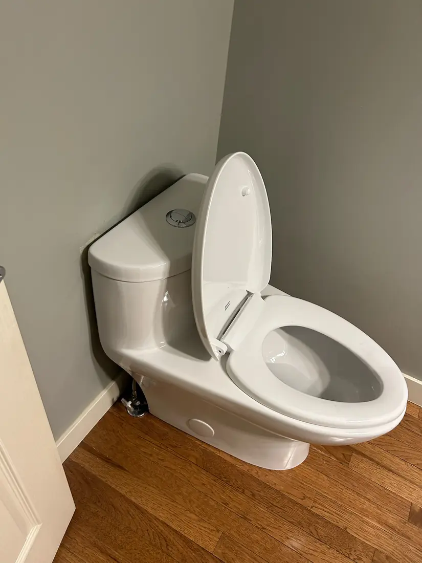 American Standard toilet installed in a residential washroom