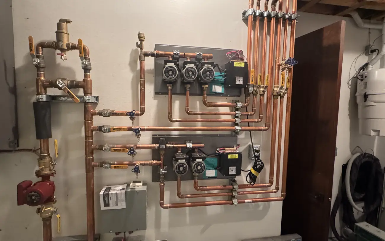 Multi-zone boiler manifold with circulator pumps and copper pipework