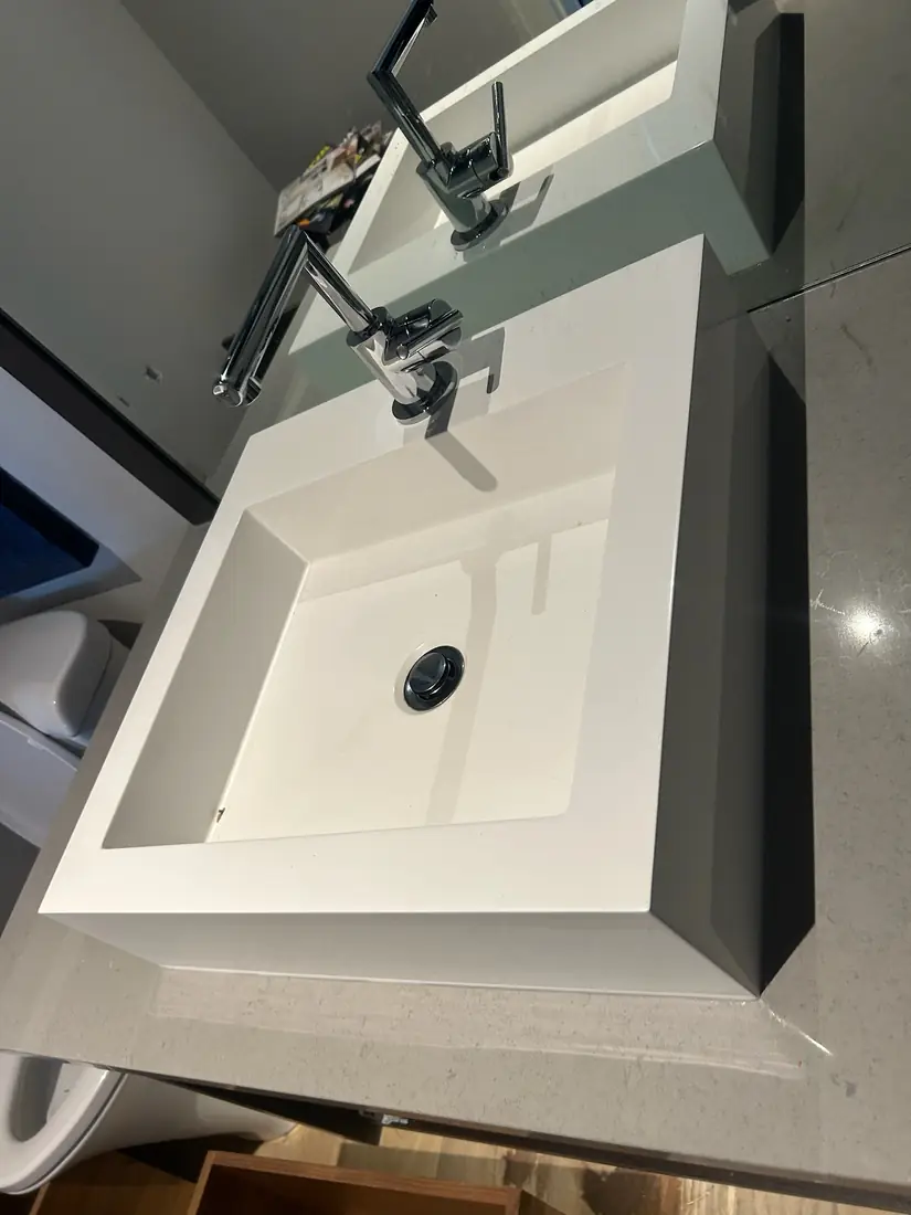 Modern square vessel basin with chrome faucets