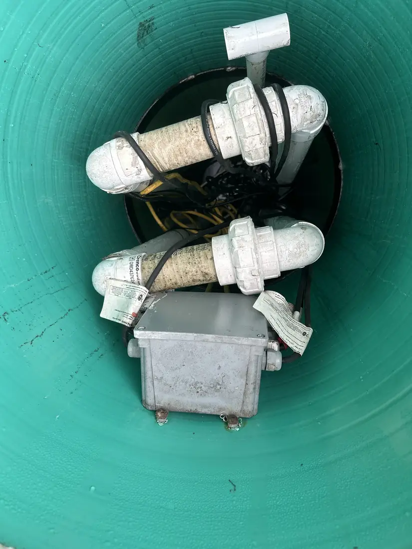 Twin effluent pumps and control wiring inside a fibreglass pump vault