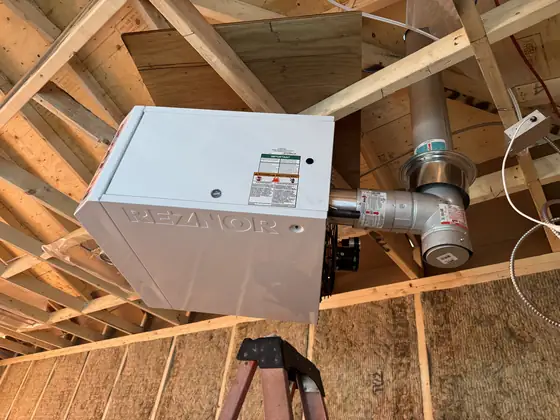 Reznor gas unit heater hung in a garage with new venting