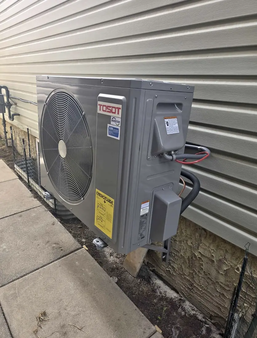 Tosot inverter heat pump outdoor unit wall-mounted on a bracket, Calgary installation